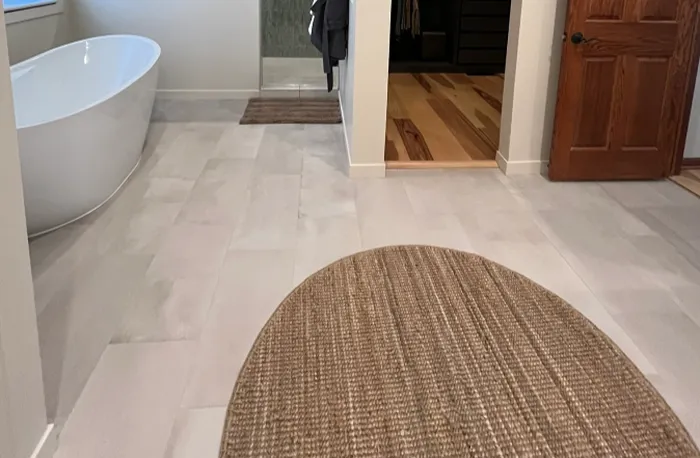 tile installation on Minnesota bathroom floor with rug 